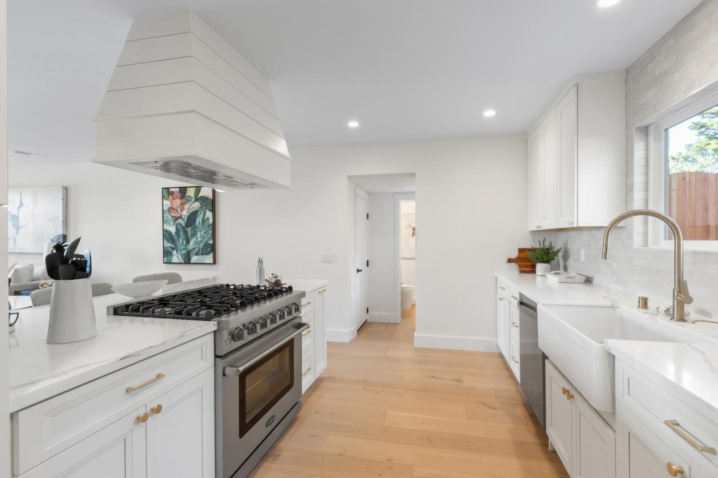 309 Channing Way Pacifica, CA 94044 - Photo 19 of 42 a kitchen with stainless steel appliances granite countertop a sink stove and cabinets