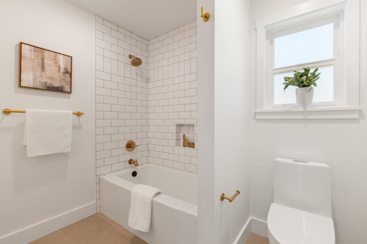 309 Channing Way Pacifica, CA 94044 - Photo 24 of 42 a bathroom with a toilet and a tub