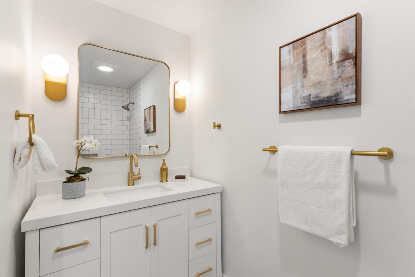309 Channing Way Pacifica, CA 94044 - Photo 25 of 42 a bathroom with a double vanity sink