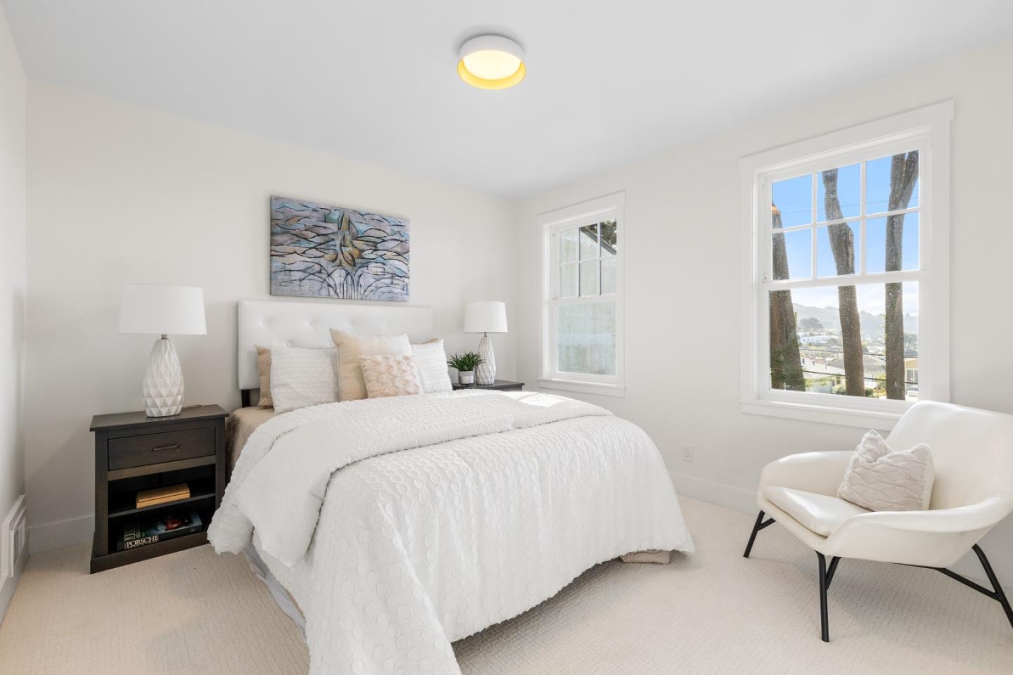 309 Channing Way Pacifica, CA 94044 - Photo 27 of 42 a bedroom with a bed and a couch