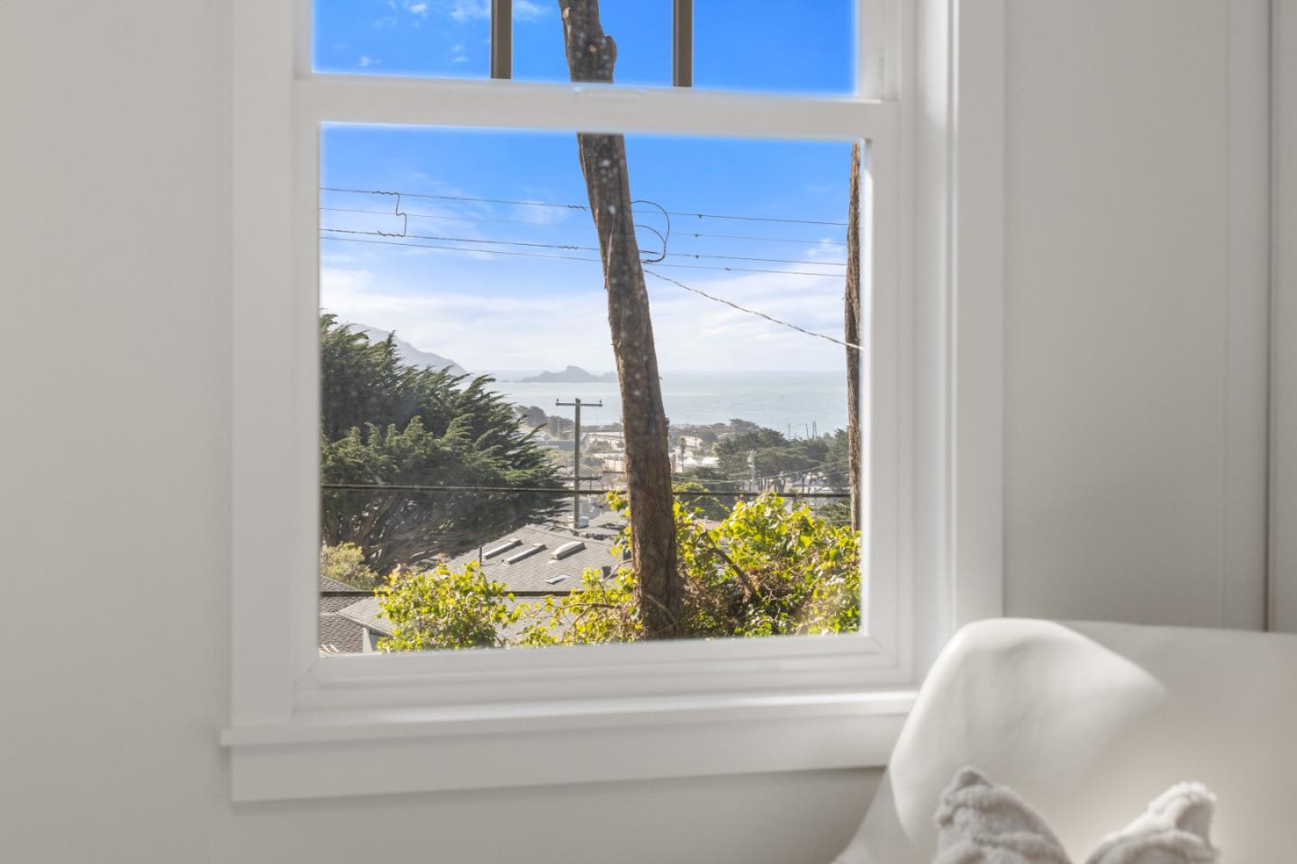309 Channing Way Pacifica, CA 94044 - Photo 28 of 42 a bathroom with a bathtub and window