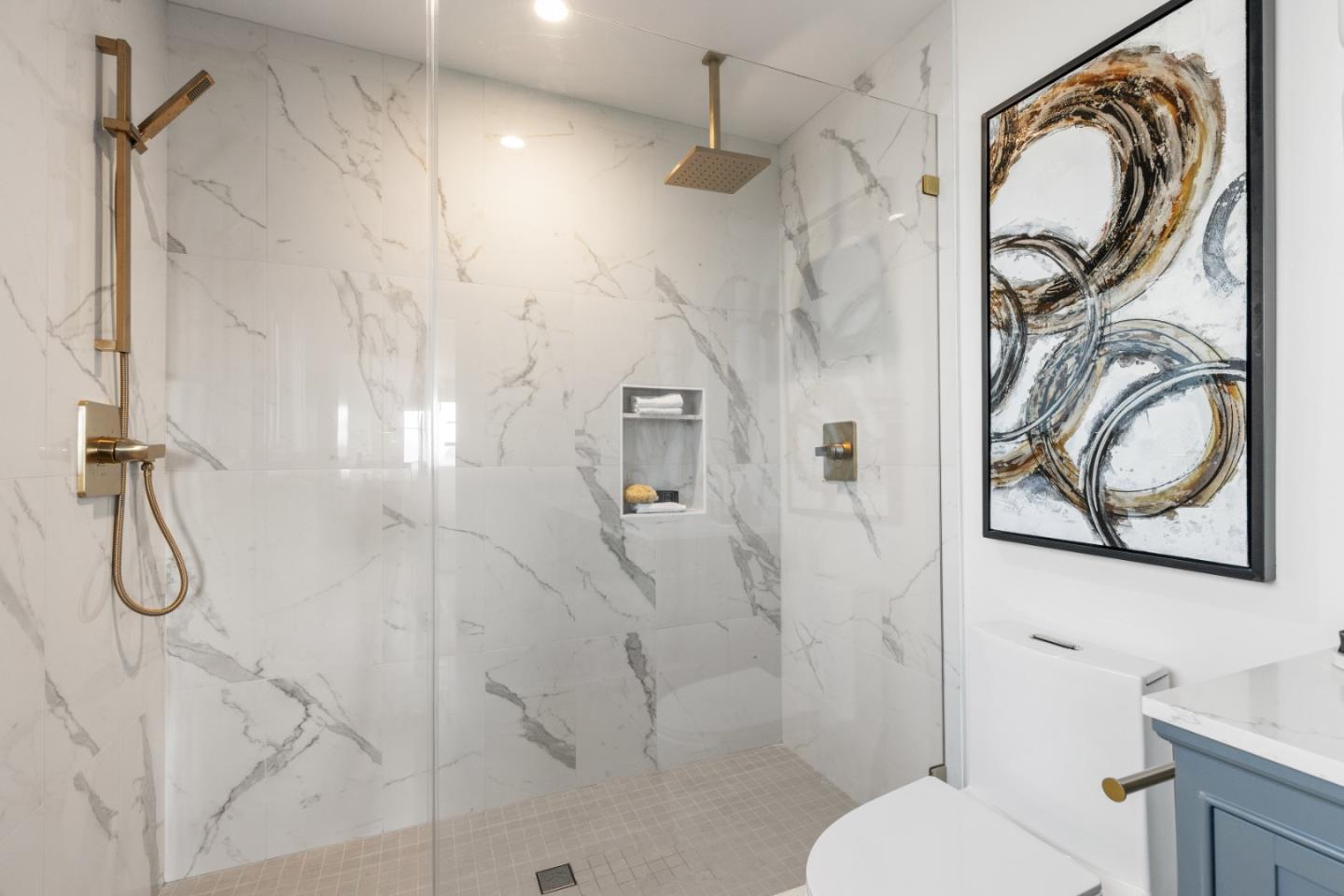 309 Channing Way Pacifica, CA 94044 - Photo 35 of 42 a bathroom with a granite countertop toilet a sink and a shower