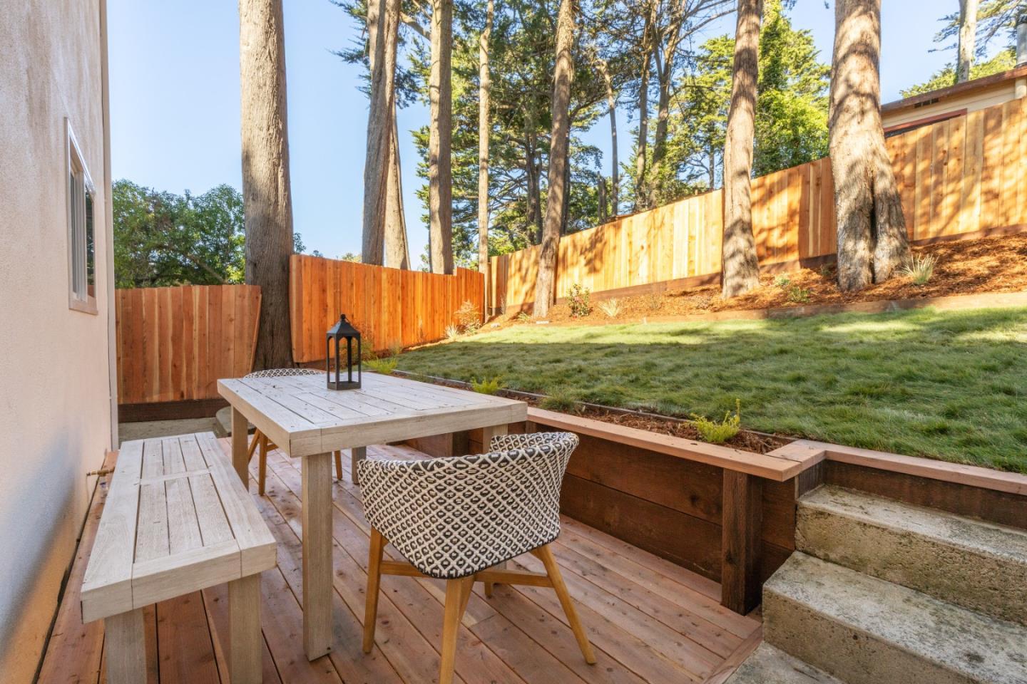 309 Channing Way Pacifica, CA 94044 - Photo 37 of 42 a view of backyard with a deck and wooden floor