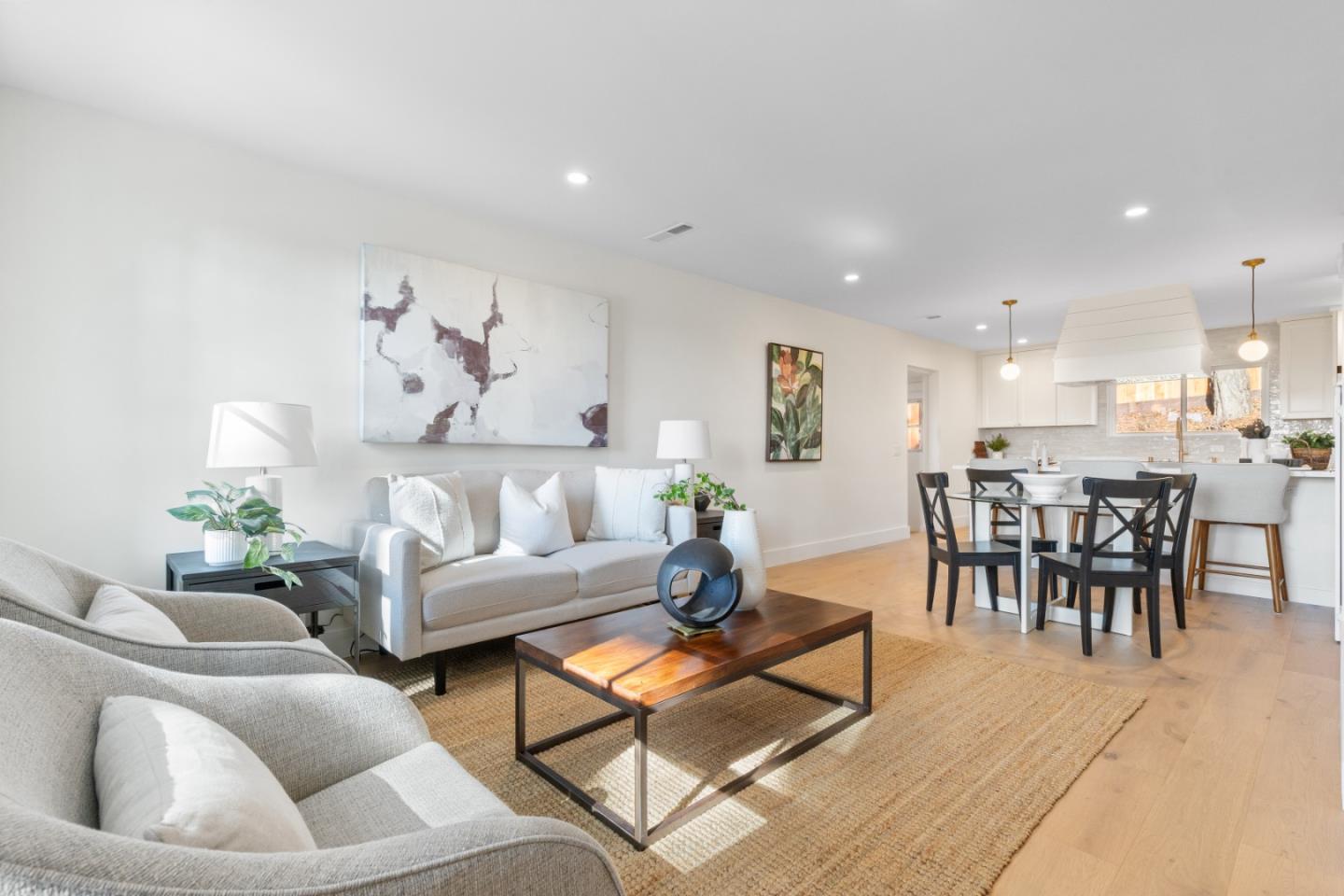 309 Channing Way Pacifica, CA 94044 - Photo 10 of 42 a living room with furniture and a dining table with kitchen view