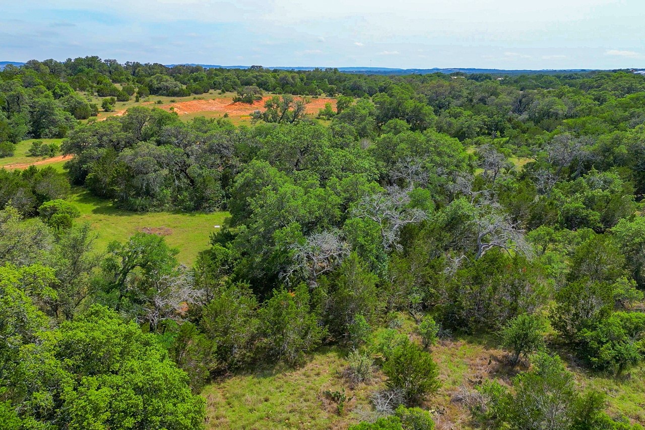 Tbd Althaus Ranch Road Johnson City, TX 78636 - Photo 11 of 36 a view of a lake and green valley