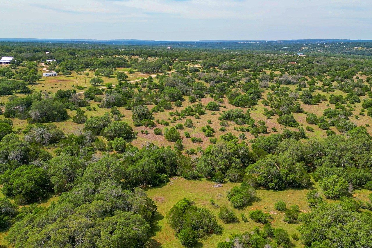 Tbd Althaus Ranch Road Johnson City, TX 78636 - Photo 13 of 36 an aerial view of residential houses with outdoor space and trees