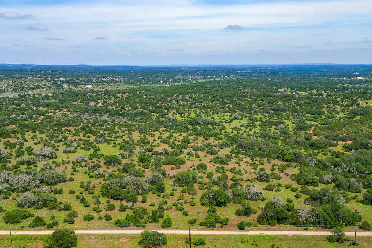 Tbd Althaus Ranch Road Johnson City, TX 78636 - Photo 6 of 36 an aerial view of residential houses with outdoor space and trees