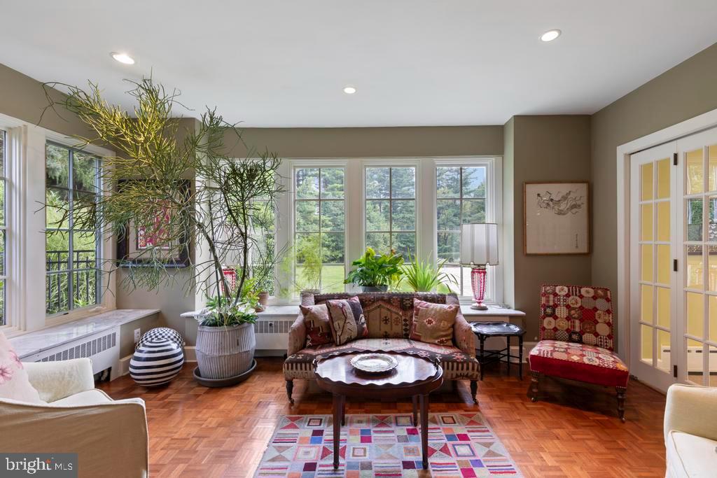 1038 Mill Rd Circle Rydal, PA 19046 - Photo 13 of 61 a living room with furniture and a potted plant