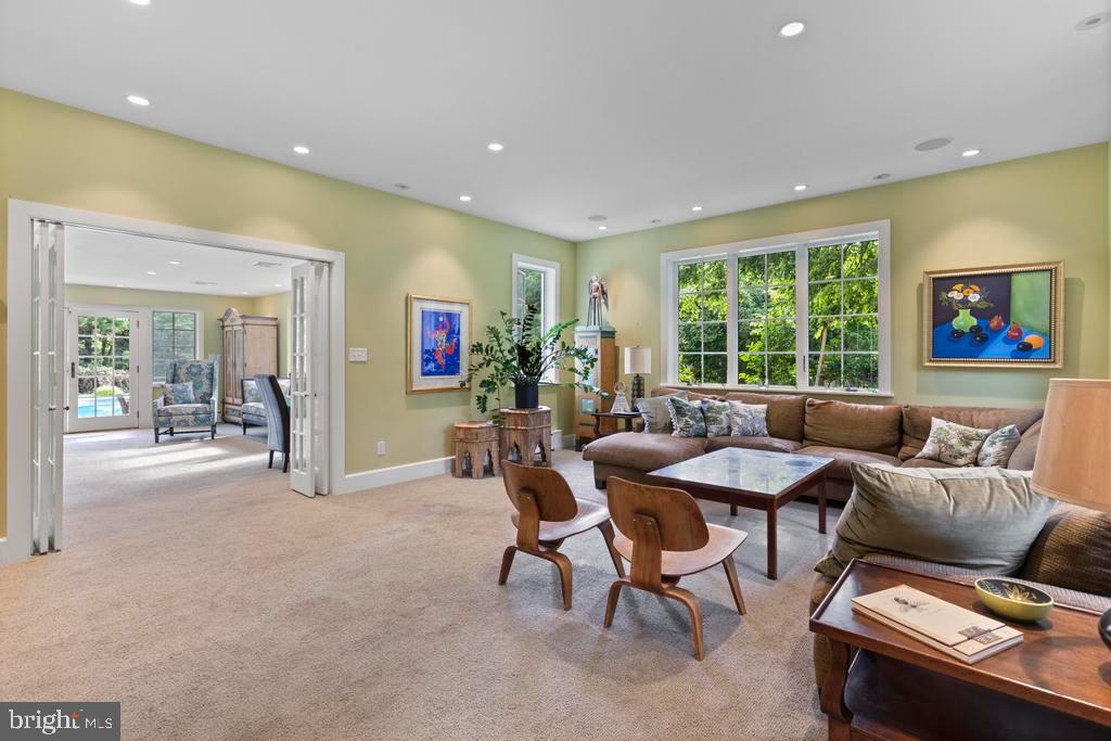 1038 Mill Rd Circle Rydal, PA 19046 - Photo 16 of 61 a living room with furniture and a large window