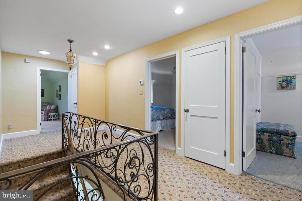 1038 Mill Rd Circle Rydal, PA 19046 - Photo 28 of 61 a view of a hallway with a chandelier