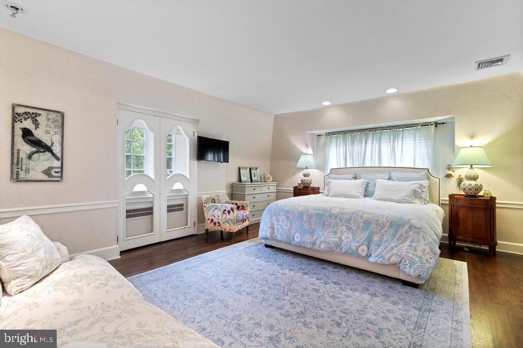 1038 Mill Rd Circle Rydal, PA 19046 - Photo 29 of 61 a spacious bedroom with a bed a couch and dresser