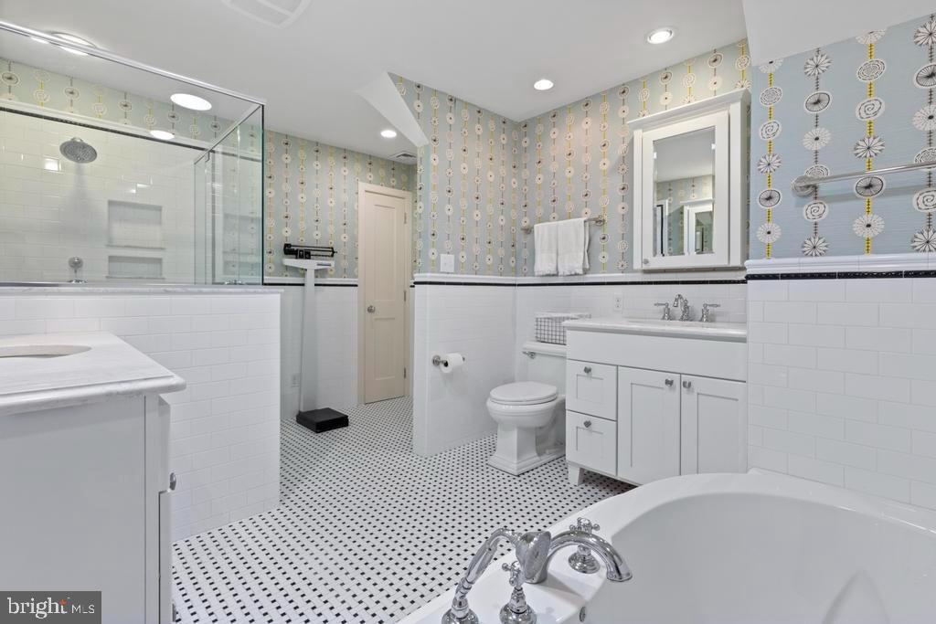 1038 Mill Rd Circle Rydal, PA 19046 - Photo 33 of 61 a bathroom with a sink a toilet a mirror and shower