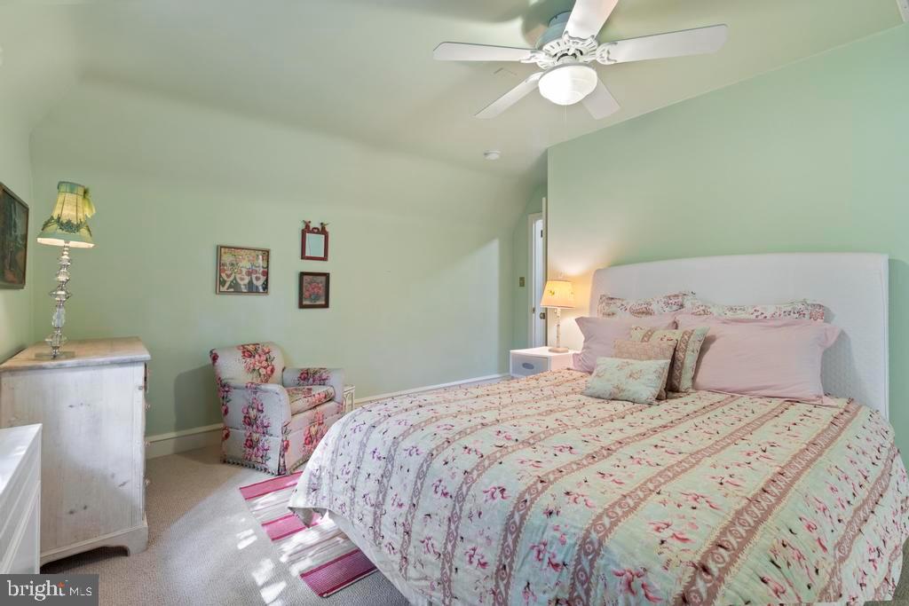 1038 Mill Rd Circle Rydal, PA 19046 - Photo 35 of 61 a bedroom with a bed and a chandelier