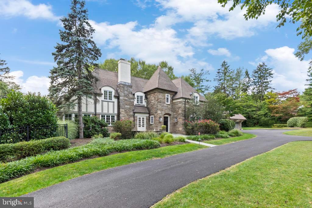 1038 Mill Rd Circle Rydal, PA 19046 - Photo 4 of 61 a front view of a house with garden
