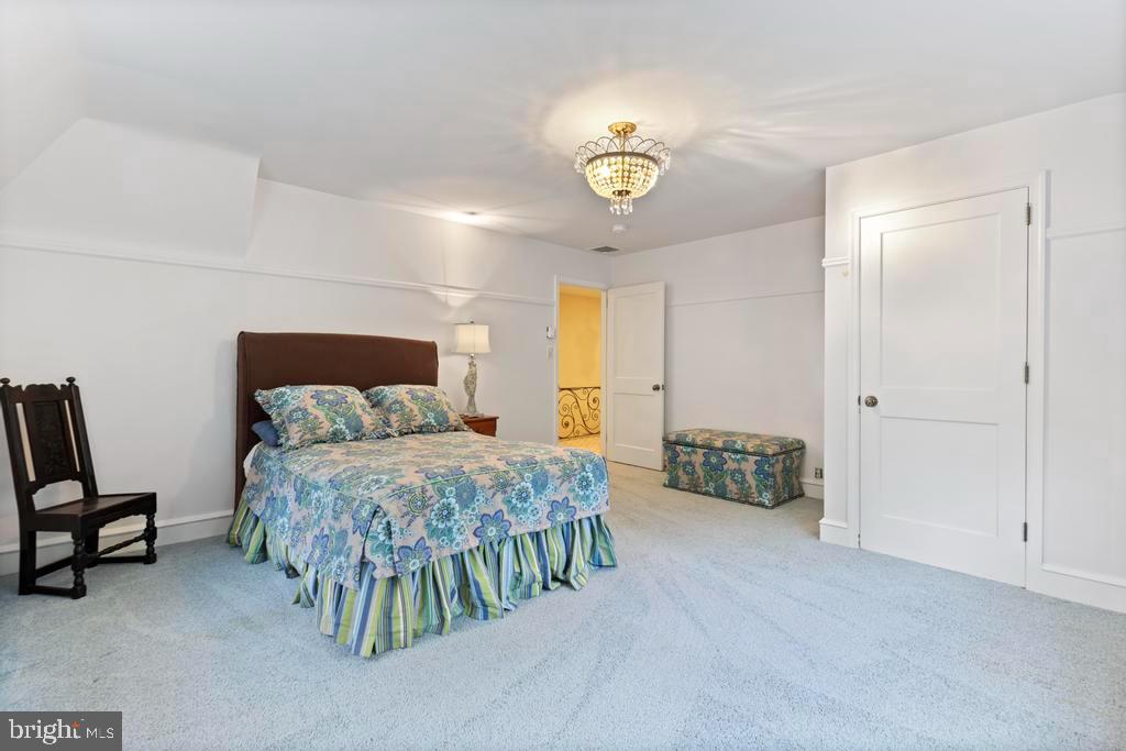 1038 Mill Rd Circle Rydal, PA 19046 - Photo 41 of 61 a bedroom with a bed and a table in it