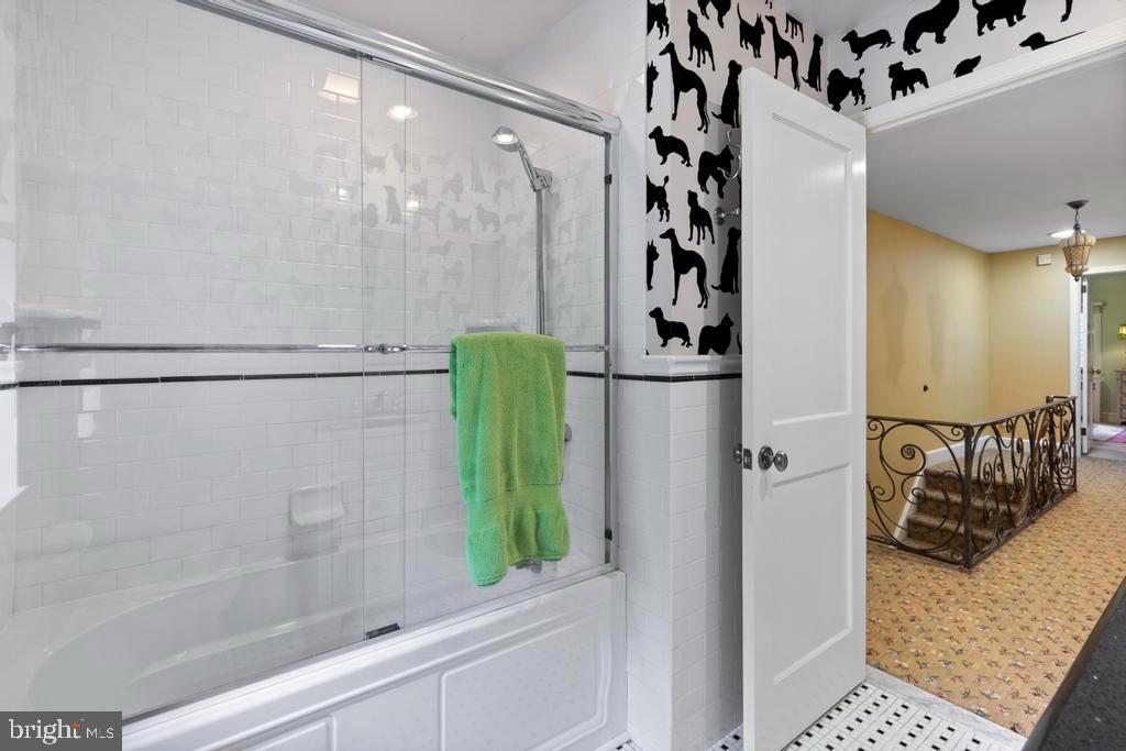 1038 Mill Rd Circle Rydal, PA 19046 - Photo 43 of 61 a bathroom with a shower and a mirror