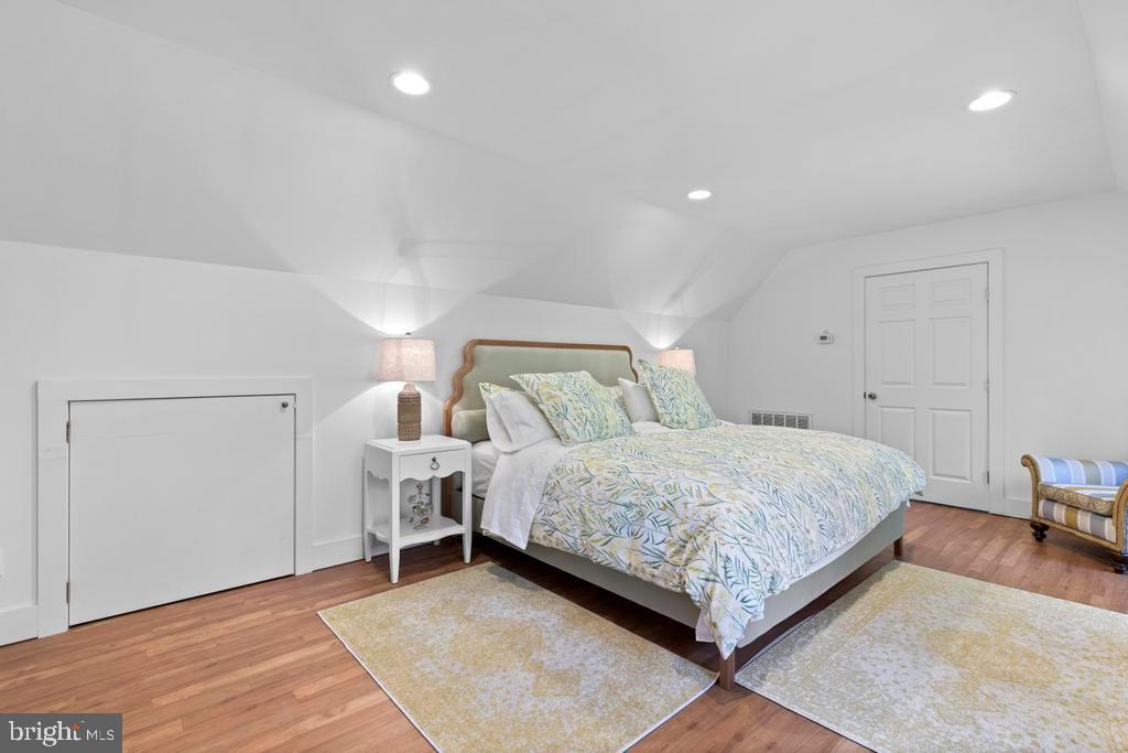 1038 Mill Rd Circle Rydal, PA 19046 - Photo 48 of 61 a bedroom with a bed and a lamp