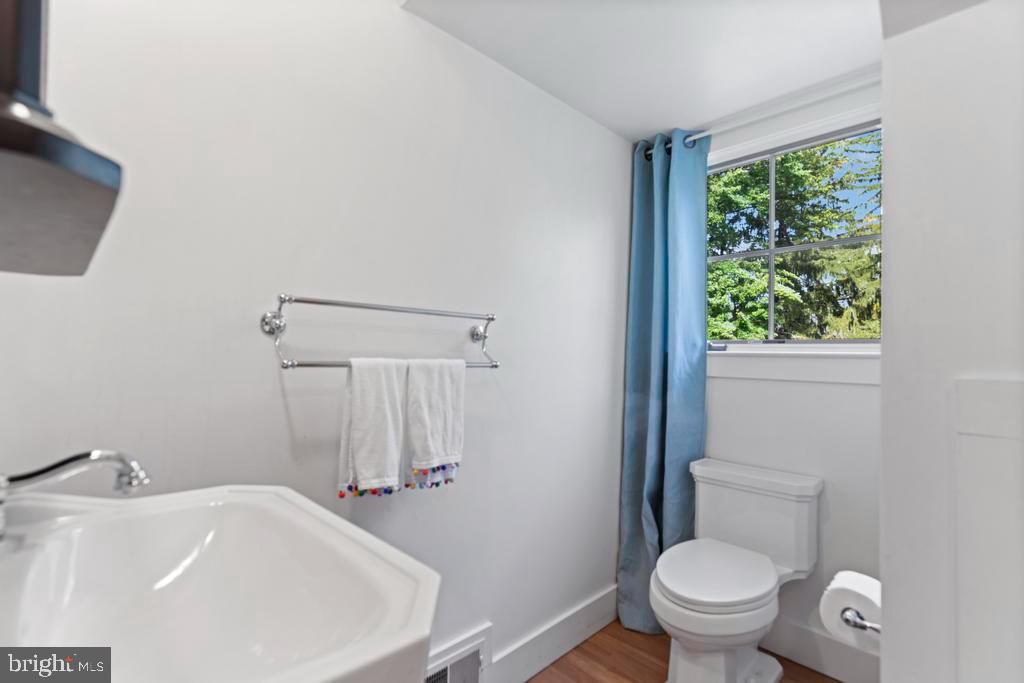 1038 Mill Rd Circle Rydal, PA 19046 - Photo 49 of 61 a bathroom with a sink and a toilet