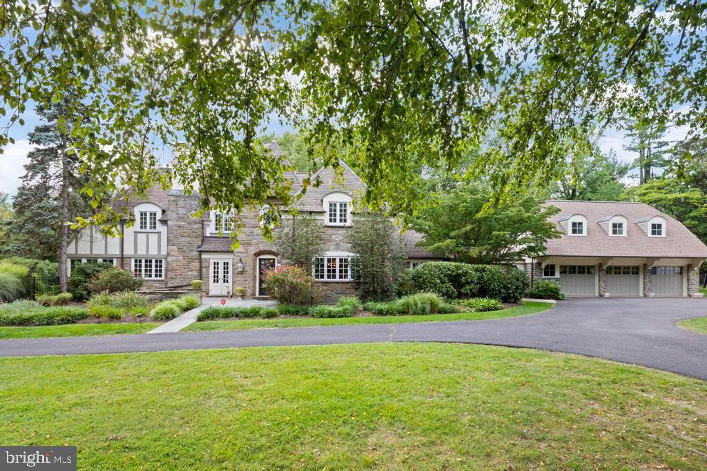 1038 Mill Rd Circle Rydal, PA 19046 - Photo 5 of 61 a front view of a building with a yard