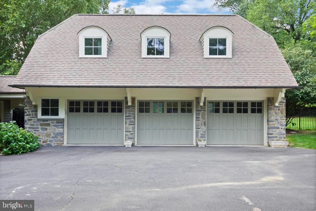 1038 Mill Rd Circle Rydal, PA 19046 - Photo 57 of 61 a front view of a house with a garden