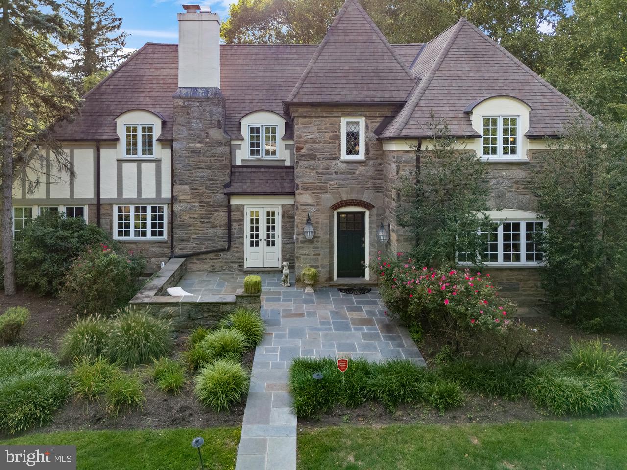 1038 Mill Rd Circle Rydal, PA 19046 - Photo 6 of 61 a front view of a house with a yard and garage