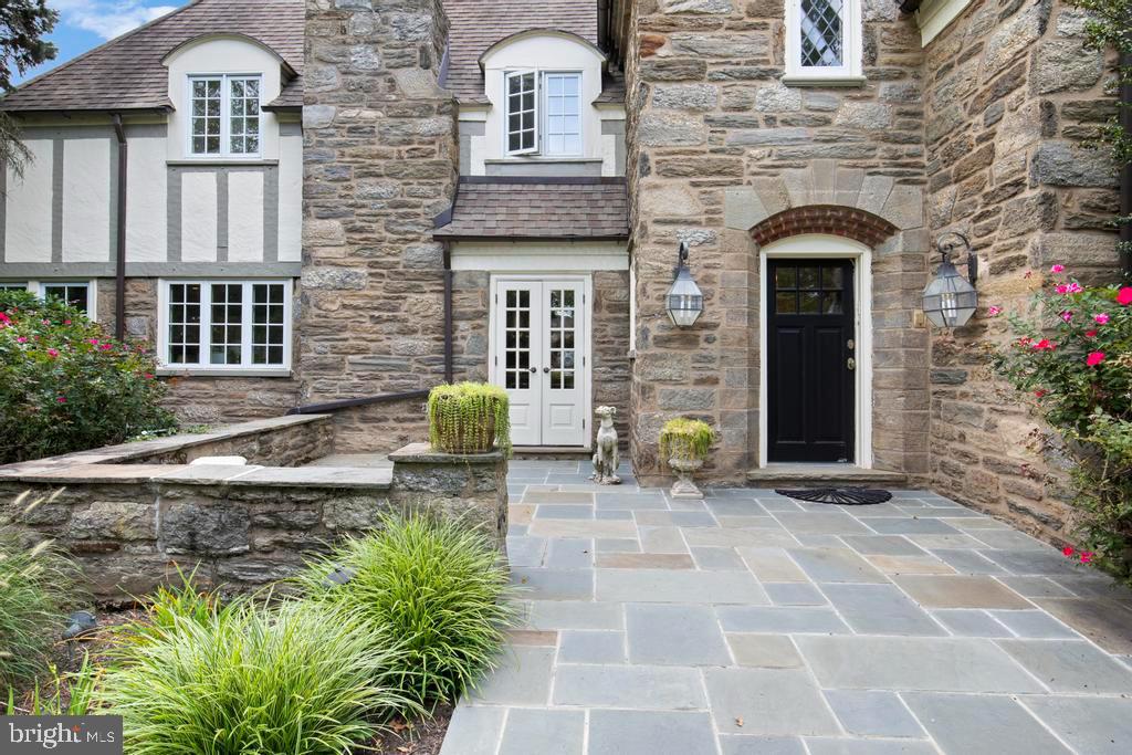 1038 Mill Rd Circle Rydal, PA 19046 - Photo 7 of 61 a front view of a house with garden