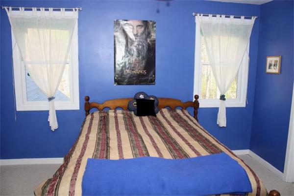 90 Bullard Road Princeton, MA 01541 - Photo 18 of 30 a view of a bedroom with wooden floor and windows