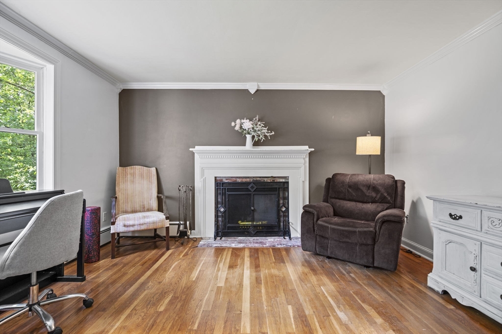 50 Haverhill Road Topsfield, MA 01983 - Photo 3 of 42 a living room with furniture and a fireplace