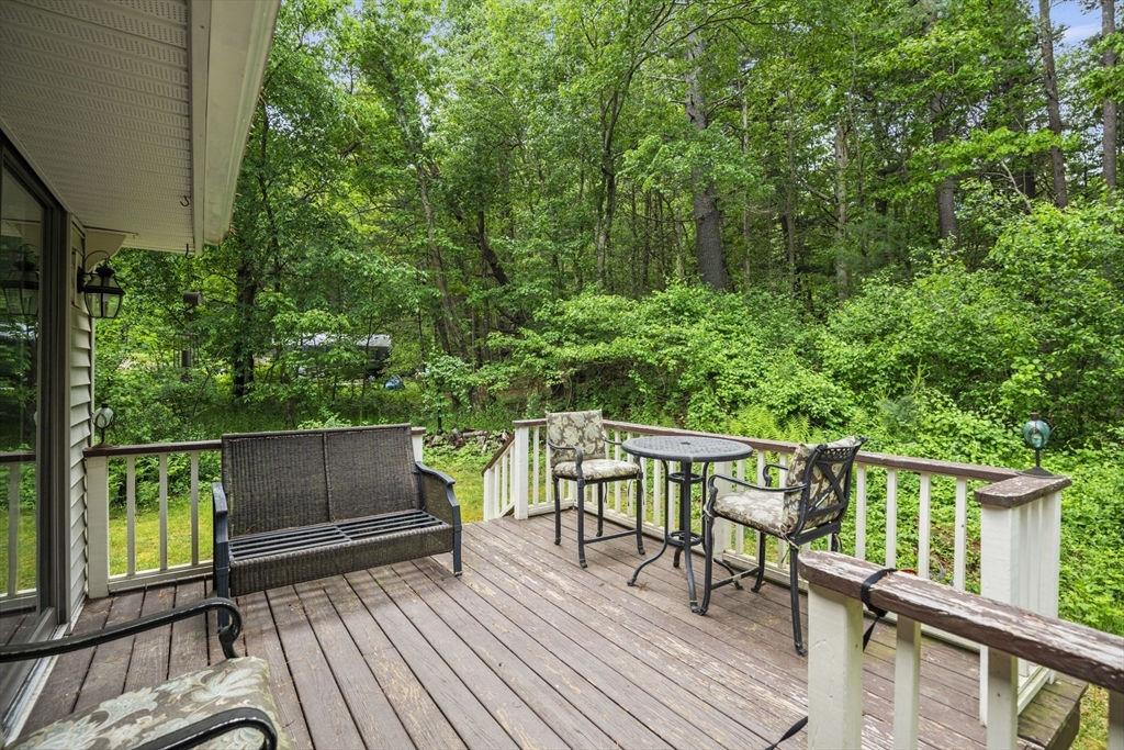 50 Haverhill Road Topsfield, MA 01983 - Photo 38 of 42 a view of a chairs and table on the wooden deck