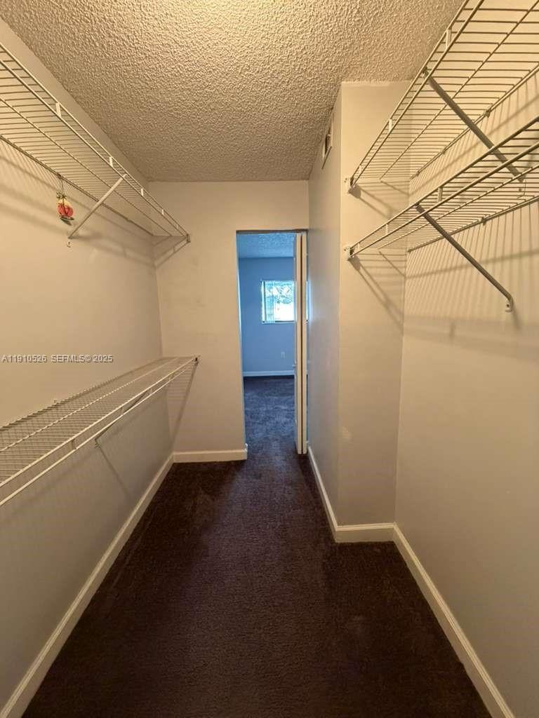 351 Palm Way, Unit 207 Pembroke Pines, FL 33025 - Photo 11 of 12 a view of a room with wooden floor