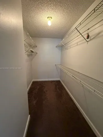 a view of a hallway with closet