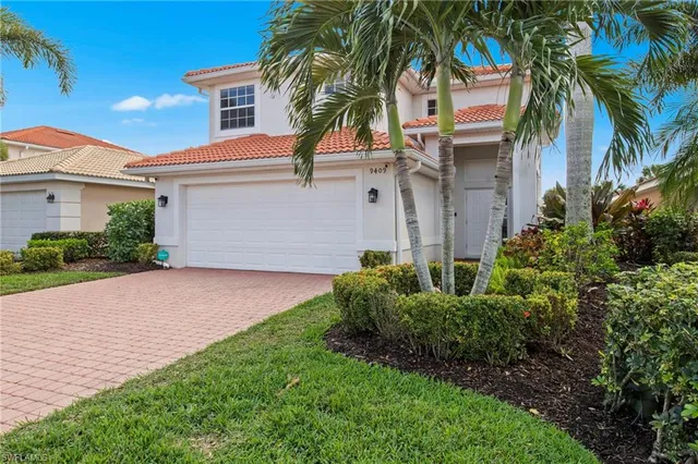 a view of a backyard with sitting area