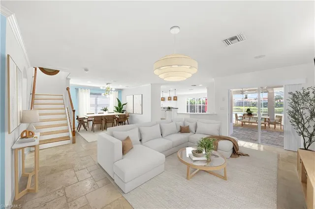 a living room with furniture and a table