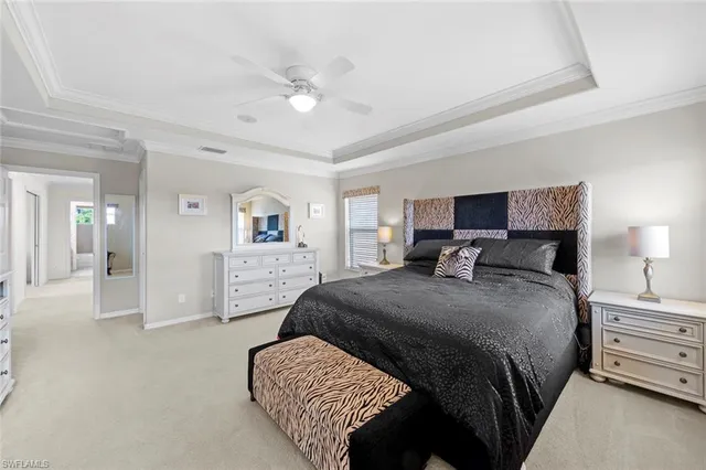 a spacious bedroom with a bed and a table in it