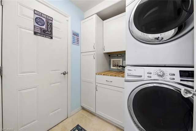 an aerial view of residential houses with outdoor space and lake view