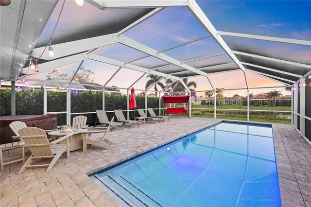 a view of a house with porch and a yard