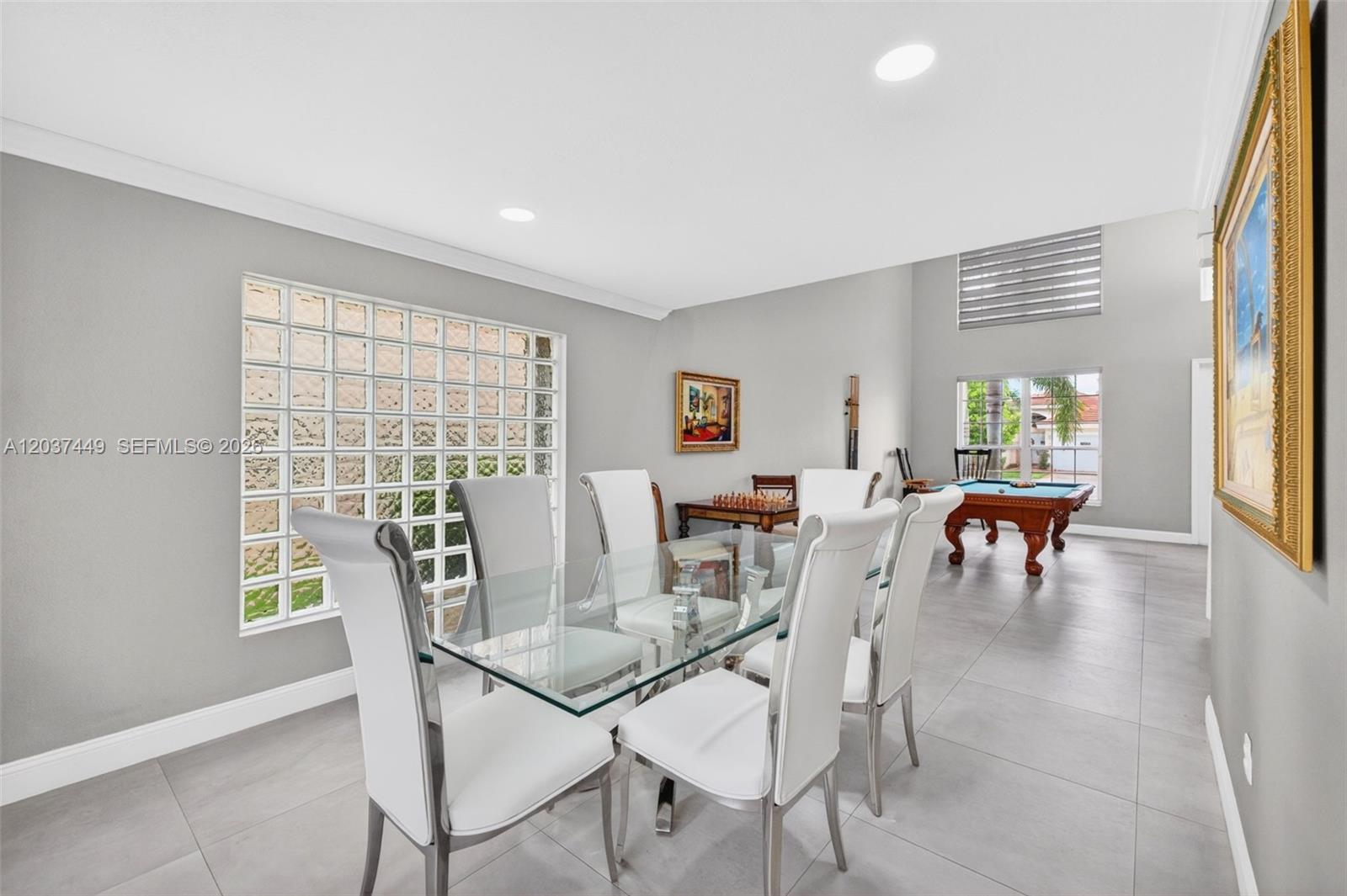 17488 Southwest 28th Court Miramar, FL 33029 - Photo 10 of 50 a view of a dining room with furniture and a large window