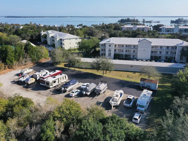front view of a brick house with a yard
