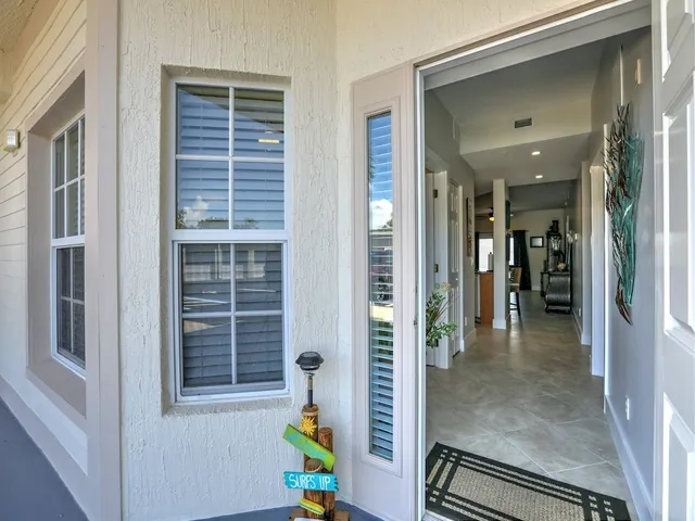 a view of hallway with seating space