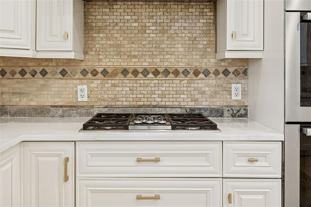 11606 Lipsey Road Tampa, FL 33618 - Photo 14 of 100 a stove top oven sitting inside of a kitchen