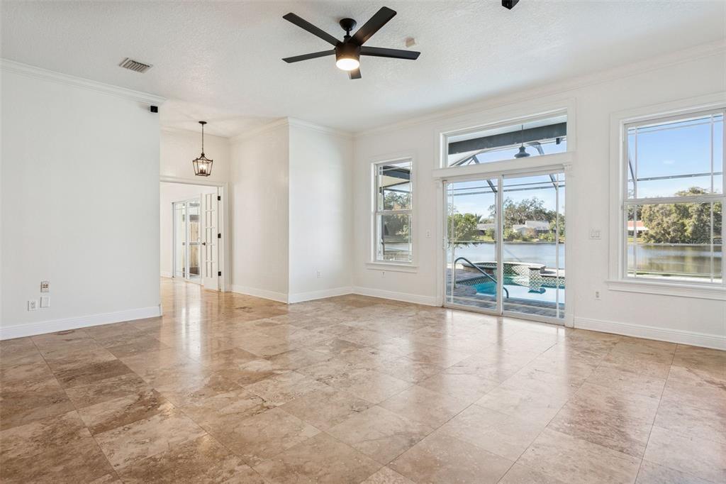 11606 Lipsey Road Tampa, FL 33618 - Photo 18 of 100 wooden floor in an empty room with a window