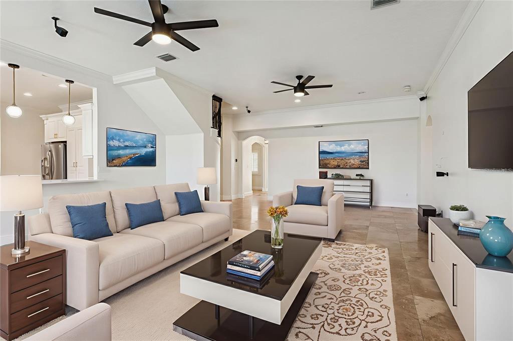 11606 Lipsey Road Tampa, FL 33618 - Photo 20 of 100 a living room with furniture and a flat screen tv