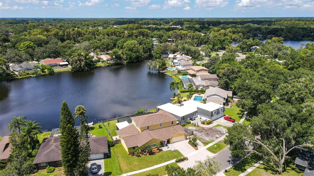 11606 Lipsey Road Tampa, FL 33618 - Photo 2 of 100 an aerial view of a house with a yard and lake view