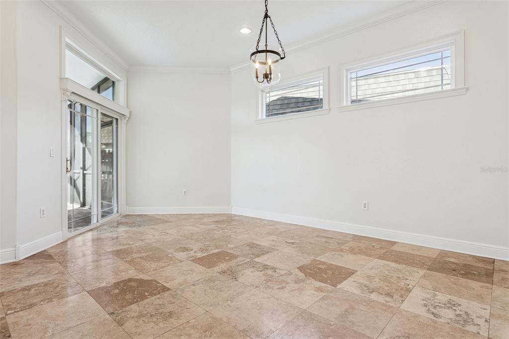 11606 Lipsey Road Tampa, FL 33618 - Photo 22 of 100 a view of an empty room with a window