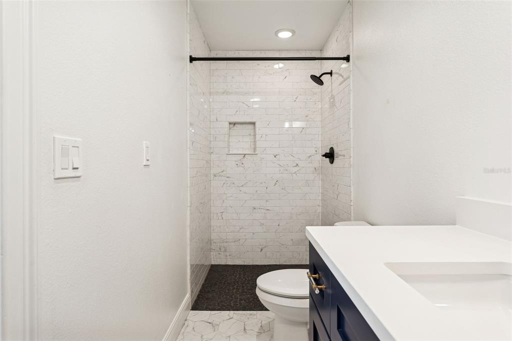 11606 Lipsey Road Tampa, FL 33618 - Photo 31 of 100 a bathroom with a sink and a toilet