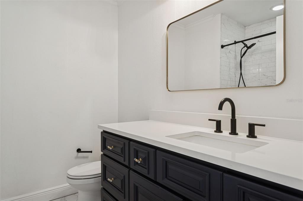 11606 Lipsey Road Tampa, FL 33618 - Photo 37 of 100 a bathroom with a sink and a toilet