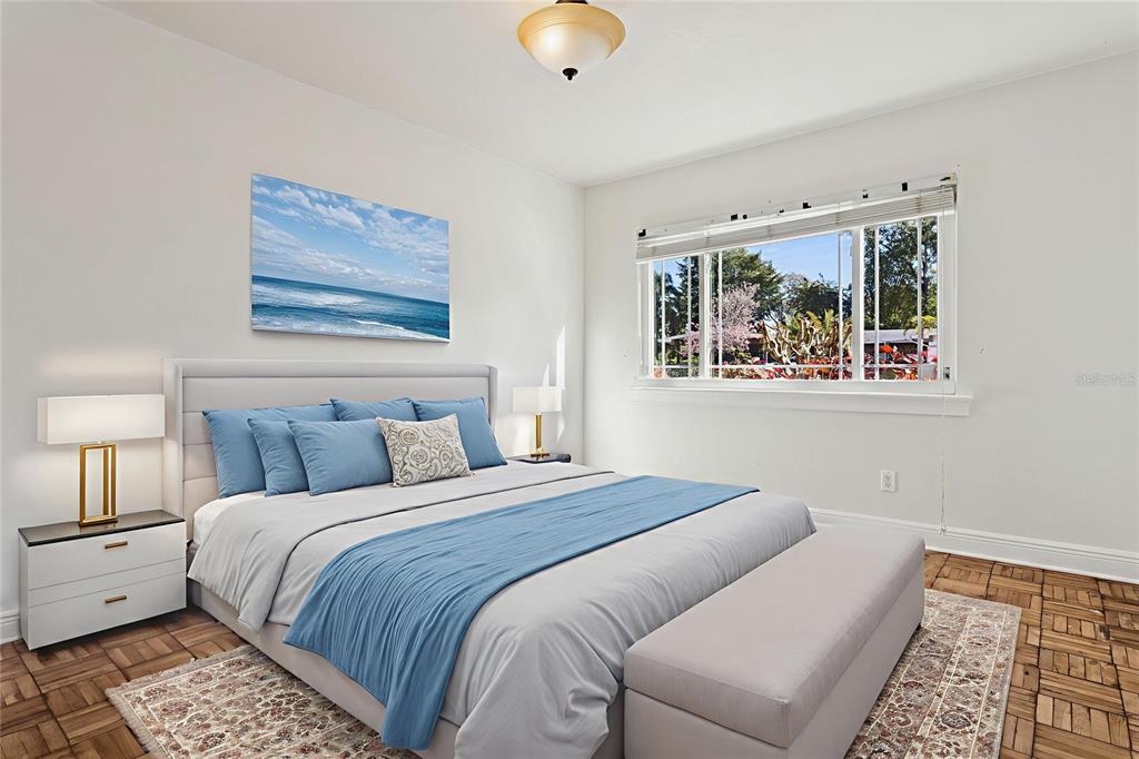 11606 Lipsey Road Tampa, FL 33618 - Photo 40 of 100 a bedroom with a bed and a large window