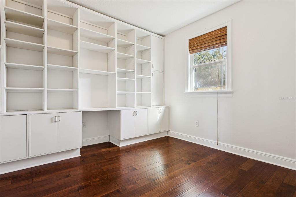 11606 Lipsey Road Tampa, FL 33618 - Photo 54 of 100 a view of an empty room with wooden floor and a window