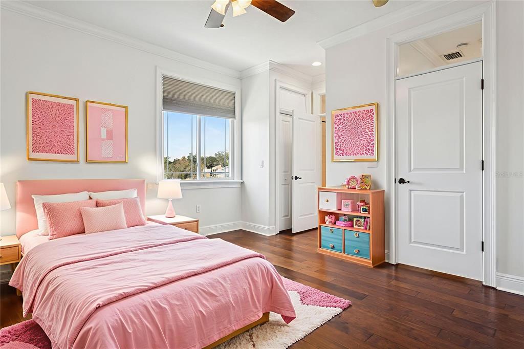 11606 Lipsey Road Tampa, FL 33618 - Photo 57 of 100 a bedroom with a bed and a dresser