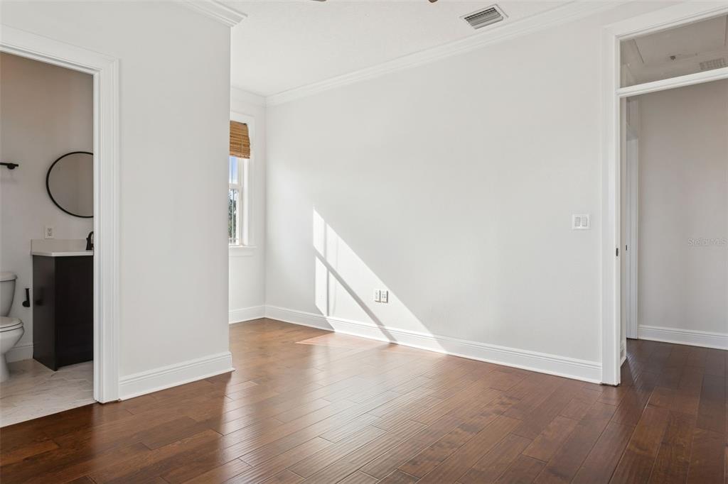 11606 Lipsey Road Tampa, FL 33618 - Photo 58 of 100 a view of an empty room with wooden floor